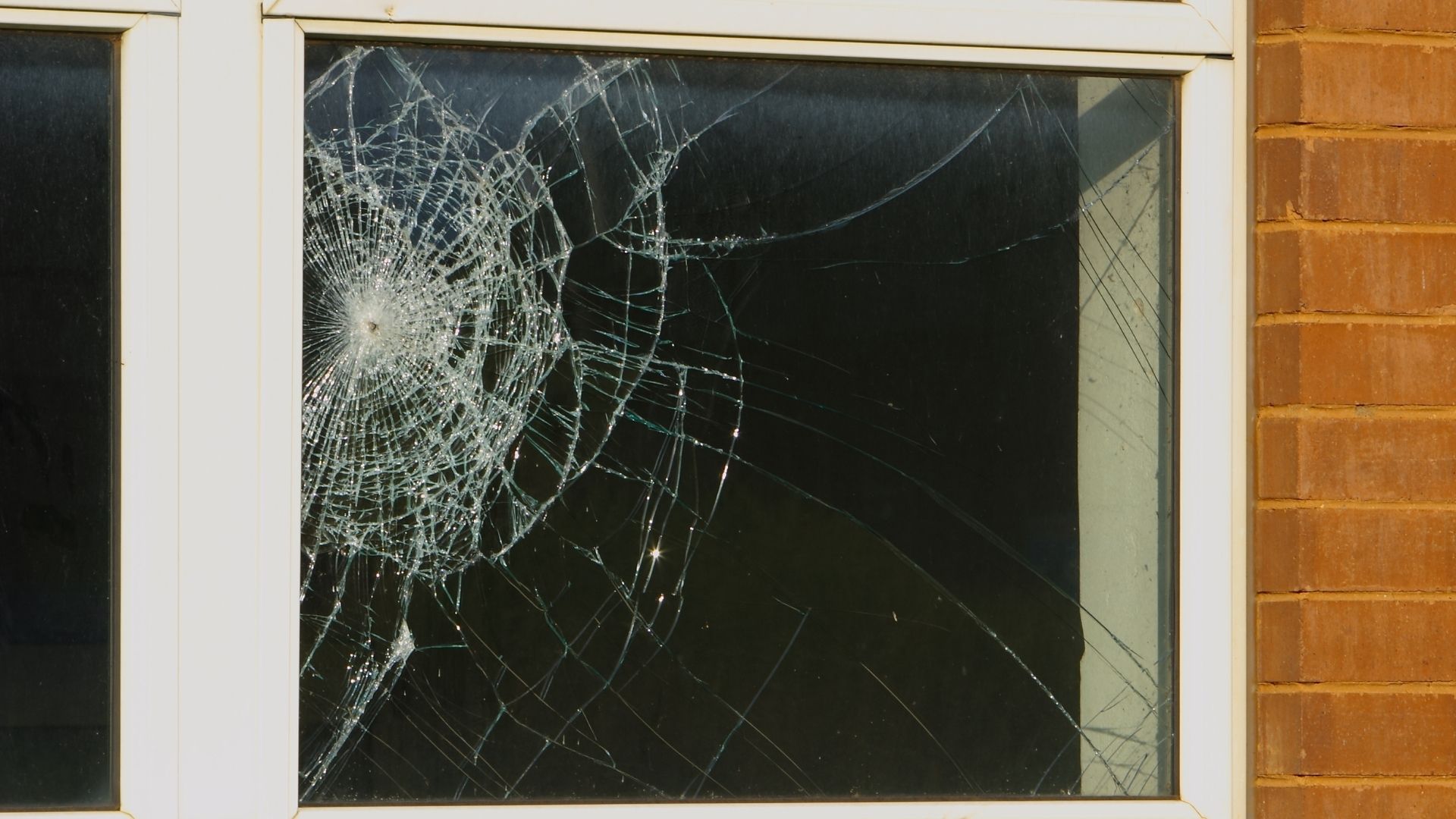 A cracked and damaged window