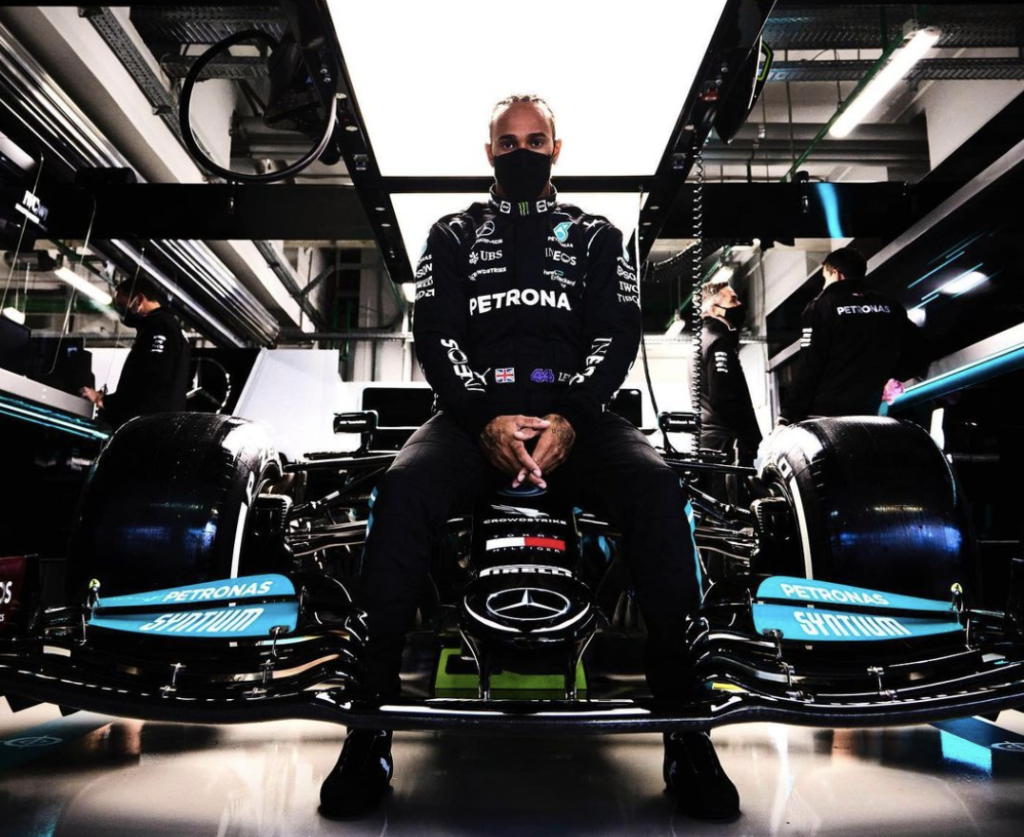 Lewis Hamilton Poses with his car