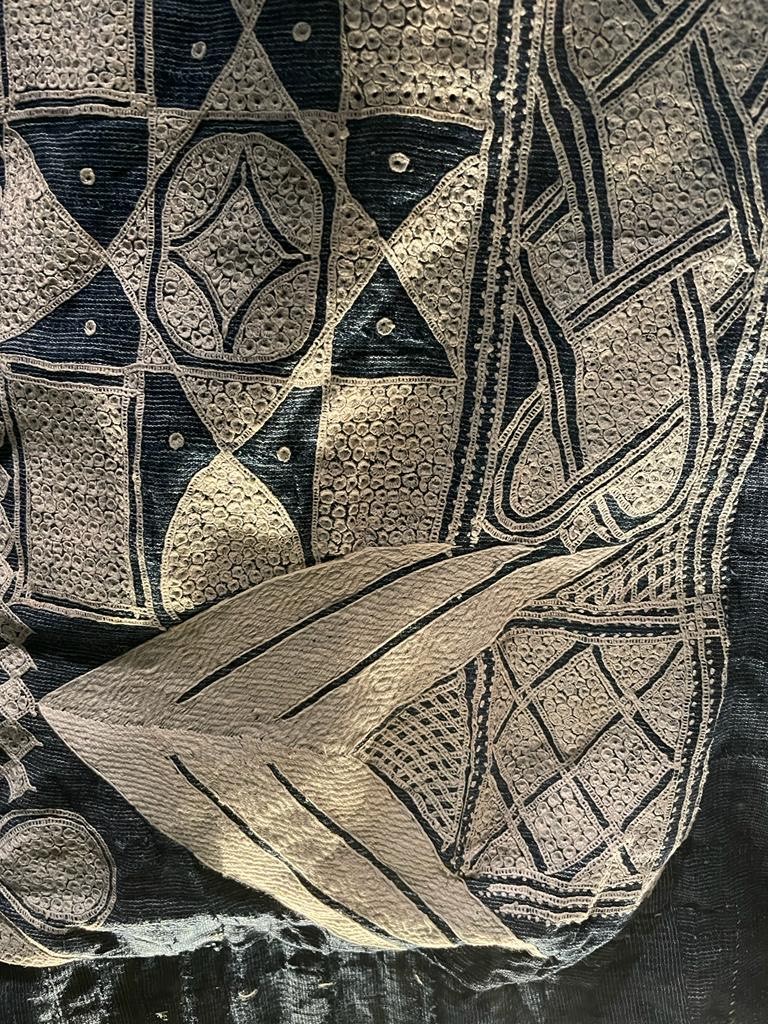 photograph showing items from the exhibition: hand woven fabric