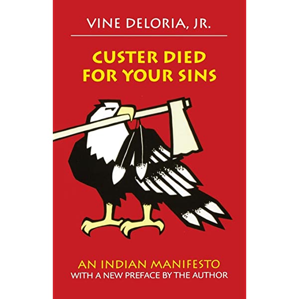 Red book cover which features an American Bald Eagle holding an axe in its beak from the book "Custer died for your sins" by Vine Deloria Jr.