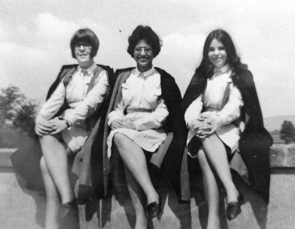 Old black and white photograph of 3 women in NHS uniforms. One of the women is dark skinned.