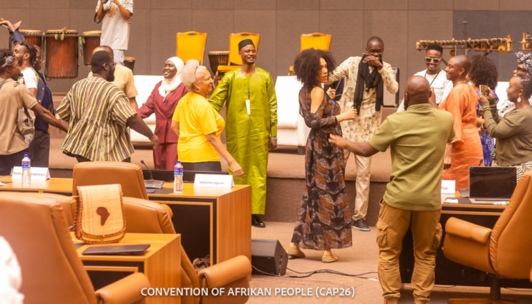 Group of Black people dancing at the end of the conference.